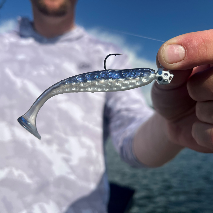 kalins hammered live series plastic with sho-w jig being held by a person with a blurred background
