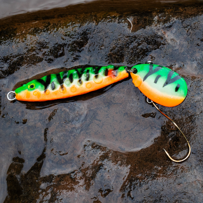 moonshine lures shiver rig in perch color pattern on a wet rock surface
